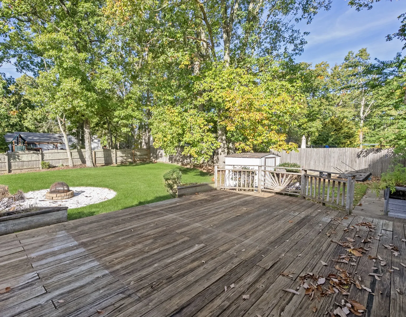 Rear wood deck overlooking the lawn and trees